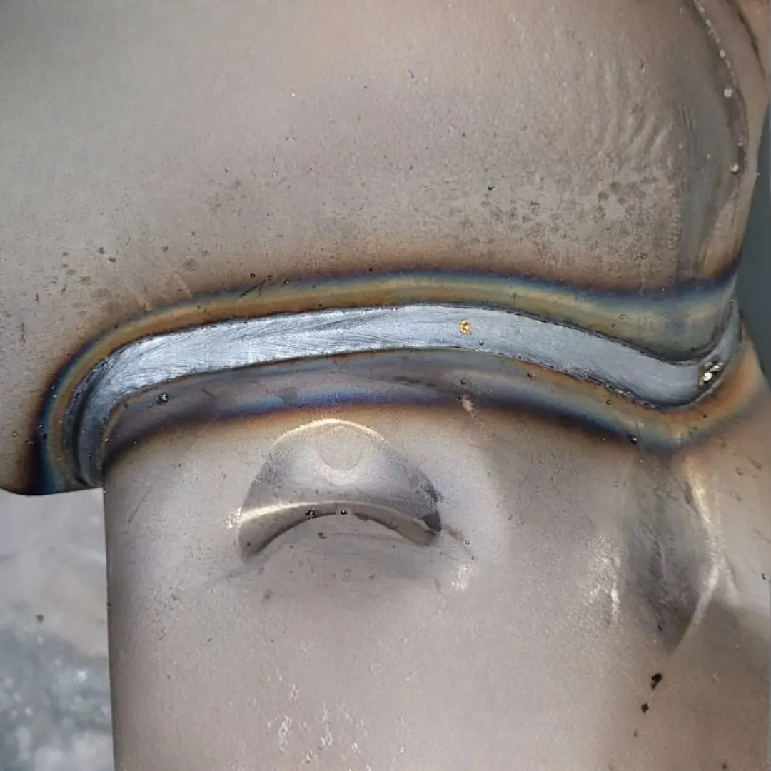 Close-up of a weld bead on a stainless steel component